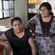 Roberto Tecpile's wife, Verónica Montalvo, and his mother, Concepciona Acahua, in the home that Tecpile's family is building in Astacinga, México, thanks to his work at a Wisconsin dairy farm. Image by Rick Barrett. Mexico, 2019.