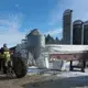 Chuck Spaulding moves his 1964 John Deere tractor into a shed while doing chores. Image by Mark Hoffman/The Milwaukee Journal Sentinel. USA, 2019.