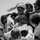 This photo was taken on a rescue boat in the Mediterranean Sea. A nine-month pregnant woman fainted because of heat and gasoline fumes from the engine of the dangerously overcrowded boat she was traveling on, in a desperate attempt to reach European shores. She took the incredibly hard decision to leave her home country, ruled by an oppressive regime, and embark on dangerous journey to guarantee a better future for her baby. She survived the crossing and gave birth few days later. Image by Gabriele Francois Casini.