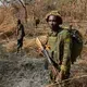 After days of pursuit, Chinko’s rangers have caught two suspected poachers deep in the Chinko bush. A raid on a their camp uncovered shotguns, machetes and carcasses of antelope, buffalo, crocodile, hippo and monkey. Image by Jack Losh. Central African Republic, 2018.