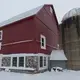 Former dairy farmer Greg Zwald walks to the renovated barn he uses as an event space at his White Pine Berry Farm. Image by Mark Hoffman. United States, 2019.