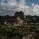 Clouds roll over the mountains near the Dar al Hajar palace in Wadi Dhahr, Yemen. Image by Alex Potter. Yemen, 2018.