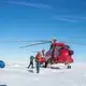 A team of three professors and three students unload the helicopter at their research site on the Greenland ice sheet. Image by Amy Martin. Greenland, 2018. 