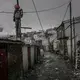 An effigy hangs from a pole as a warning to criminals. Mob justice and these kinds of warnings are common in communities in Peru and Bolivia. A reported 10 police officers keep the peace here. The presence of large quantities of gold and widespread alcohol consumption make crime a major issue in this Andean settlement. Peru, 2019. Image by James Whitlow Delano.