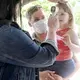 Amy Waddell holds her daughter, Aliza, 3, as her temperature is checked before spending the day at Montmorenci United Methodist Church’s day care in Candler on June 23. Image by Angela Wilhelm/Asheville Citizen Times/North Carolina News Collaborative. United States, 2020.</p>
<p>