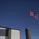 An American flag blows in the wind on a fall day at the Kimberley farm, on Tuesday, Oct. 17, 2017, outside of Maxwell. Image by Kelsey Kremer.