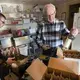 Tom Rohland fillls cases of wine with the help of Isaac Mathison, left, at the Munson Bridge Winery in Withee. Image by Mark Hoffman. United States, 2019.