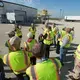 J.J. Pagel, (hands in the air) of Pagel's Ponderosa, a dairy farm, shows members of the Wisconsin Natural Resources Board a system that converts manure into methane gas. Image by Mark Hoffman. United States, 2019.