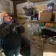 Christy Spexet holds one of the many barn cats. Spexet names every cow and cat on the Spaulding family's farm. Image by Mark Hoffman/The Milwaukee Journal Sentinel. USA, 2019.