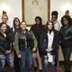 Guttman Community College students gather alongside Guttman Community College interdisciplinary studies instructor, Katie Wilson, following a panel at the Roosevelt House in New York which focused on the global impact of the refugee crisis. Image by Matt Capowski. United States, 2017.
