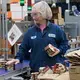 Kathy Griffey, top, and Kristin Geary, bottom right, work on an assembly line packaging Balanced Breaks snacks at Sargento Foods Inc. The company employs about 2,300 people in Wisconsin. Image Courtesy of Mark Hoffman. United States, 2019.