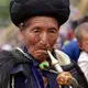 An Yi elder joins the crowds attending torch festival celebrations in Liangshan prefecture Sichuan province. Image by Max Duncan. China, 2016.