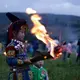 A Yi boy holds a flaming torch during Torch Festival celebrations in Liangshan prefecture, Sichuan province. Image by Max Duncan.  China, 2016.