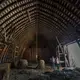 Bruce Drinkman and his companion, Betty Jo Johnson, stand in the hayloft designed to hold about 10,000 bales of hay at the farm in Ridgeland. Drinkman, a former dairy farmer, purchased this small farm in Dunn County. Image by Mark Hoffman. United States, 2019.