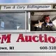 Cory Bidlingmaier solicits bidders interested in hay during an auction. Image by Mark Hoffman. United States, 2019.