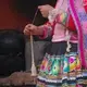 In Cuzco, Peru we went to a store that makes clothes, rugs/carpet, jewelry and they showed us how they make alpaca wool turn into this beautiful work of art filled with vibrant color and intricate patterns. This picture captures a woman making alpaca wool into string to prepare it to be dyed by using natural products. This was our first day in Peru where we were also really exposed to the culture and shown how this was also their lifestyle where they do this everyday for a living. Image by Cristin Pearson. Peru, 2018.<br />