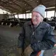 Still recovering from a stroke, Chuck Spaulding takes a break while doing chores. The Spauldings have partnered with their daughter and her husband to run the farm, S & S Dairy. Like most dairy farmers they are struggling to make ends meet because of milk prices that do not cover expenses. Image by Mark Hoffman/The Milwaukee Journal Sentinel. USA, 2019.