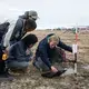 Sebastian Zastruzny, a researcher at the Center for Permafrost (CENPERM) who has been studying permafrost in the region for several years, takes measurements with the help of Qaanaaq residents. There is no word for permafrost in the Greenlandic language. Greenland, 2019. Image by Anna Filipova. 