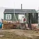 A family lives in this sinking, rotting home. The worst damage is done in autumn and spring, when the ground freezes and thaws. Increased rainfall in the autumn can also wreak havoc. Greenland, 2019. Image by Anna Filipova.