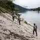 Villagers and Kachin Independence Army officers walk into the Chipwi dam project area, which was stopped in 2012 due to fighting in Chipwi, Kachin State, Myanmar. Image by Hkun Lat. Myanmar, 2019.