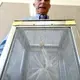 Steve Mulligan, district manager of the Consolidated Mosquito Abatement District, holds a container with Aedes aegyptimosquitoes during a news conference at the Fresno County Department of Health in July 2016. Image by John Walker / The Fresno Bee. United States, 2016.