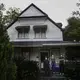 Erick Brown, left, Saundra Brown, center, and George Savage, right, stand on their porch while social distancing and wearing protective masks amid the COVID-19 coronavirus outbreak on Friday, April 17, 2020, in Dawson, Ga. Image by Brynn Anderson / AP Photo. United States, 2020.