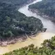 Storm water flowing south from Houston overflowed the banks of the Brazos River, sweeping away trees and earth, and flooding low-lying neighborhoods. Image by Alex MacLean. United States, 2017. 