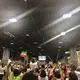 That afternoon, a lucky fraction of the crowd who had been waiting since the early hours of the morning would make it into the room where Abiy would give his speech. Others were packed into rooms with large TVs to watch his speech live. Image by Claire Potter. Unites States, 2018.