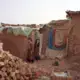 Mud homes shelter the thousands of Afghan refugees who have settled in I-12. Image by Sara Hylton. Pakistan, 2018.