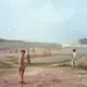 Children play near a pond. Image by Sara Hylton. Pakistan, 2018.