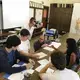 Diana Greene, who developed and facilitated the Weaving Connections program, and Pulitzer Center Senior Education Manager Fareed Mostoufi work with students to develop story ideas for their part of the Weaving Connections documentary. Image by Karen Morris. United States, 2017.