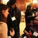 Student fellows Amanda Gordon, Monica Long, and Alexis Smith talk before the evening dinner. Image by Karena Phan. United States, 2018.