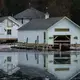 Boathouses are being removed from flooded docks in Snows Channel at Les Cheneaux Islands in the Upper Peninsula of Michigan on Nov. 20, 2019. Image by Zbigniew Bzdak / Chicago Tribune. United States, 2020.