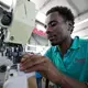 In the Chinese-owned Huajian Shoe Co. Factory in Addis Ababa, more than 6,000 workers build shoes for American brands such Tommy, Guess and Lucky. Image by Noah Fowler. Ethiopia, 2017.