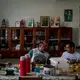 Father Amaro Lopes, center, eats breakfast with others at the bishop’s house in Altamira. Image by Spenser Heaps. Brazil, 2019.