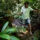 Elias da Silva Lima, 63, walks through the forest between his home and a clearing he farms on the Virola Jatoba settlement in Anapu. Image by Spenser Heaps. Brazil, 2019.