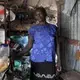 Manette Francois, 58, says that before the Jan. 12, 2010, earthquake she had an easier life than today. She lives in a tent city, Teren Toto, in Delmas, in a tin shack that doubles as living quarters and neighborhood grocery store. Image by Jose A. Iglesias. Haiti, 2019.