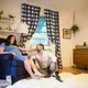 Sloane Borr, at nine months pregnant, sits with her husband, Paul, in their baby's room. Image by Roy Llera. United States, 2017.