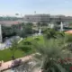 A view from the rooftop of a villa in The Sustainable City’s residential sector. The large tan building in the background is the newly-opened Fairgreen International School. Image by Anna Gleason. United Arab Emirates, 2019.