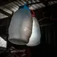 Jasmine Durana hopes that these containers, hanging from the rafters of her makeshift house in a Navotas slum, will help her launch a new business selling drinks in the market or in front of a local school. Image by James Whitlow Delano. Philippines, 2018. 