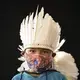 Six-year-old Ezinaldo dos Santos, of the Sateré Mawé indigenous ethnic group, poses for a portrait wearing the traditional dress of his tribe and a face mask amid the spread of the new coronavirus in the Gaviao community near Manaus, Brazil, Friday, May 29, 2020. Image by Felipe Dana / AP Photo. Brazil, 2020.