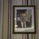 A photo of Terry Branstad, former governor of Iowa and current U.S. ambassador to China, hangs on the wall of the Hamburg Inn No. 2 on Rochester Avenue in Iowa City on Friday, Oct. 6, 2017. The note reads, 'Michael Lee, Congratulations on the new Hamburg Inn.' Image by Kelsey Kremer. United States, 2017.