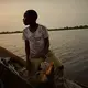 A boy sells his day’s catch on the Congo river in Équateur province. Image by Hugh Kinsella Cunningham. Congo, 2019.