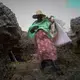 A seaweed farmer carries a life jacket for her boat trip into the deep water. Many women in Zanzibar cannot swim. Image by Haley Joelle Ott. Zanzibar, 2017.