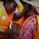 Dr. Flower Msuya is piloting a new technology for deep sea farming, adapted from Brazil. So that female farmers can safely go out to the deeper waters, she provides life jackets for the women who can't swim. Image by Haley Joelle Ott. Zanzibar, 2017.