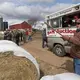 Tom Bidlingmaier points out a bidder on hay during an auction. Image by Mark Hoffman. United States, 2019.