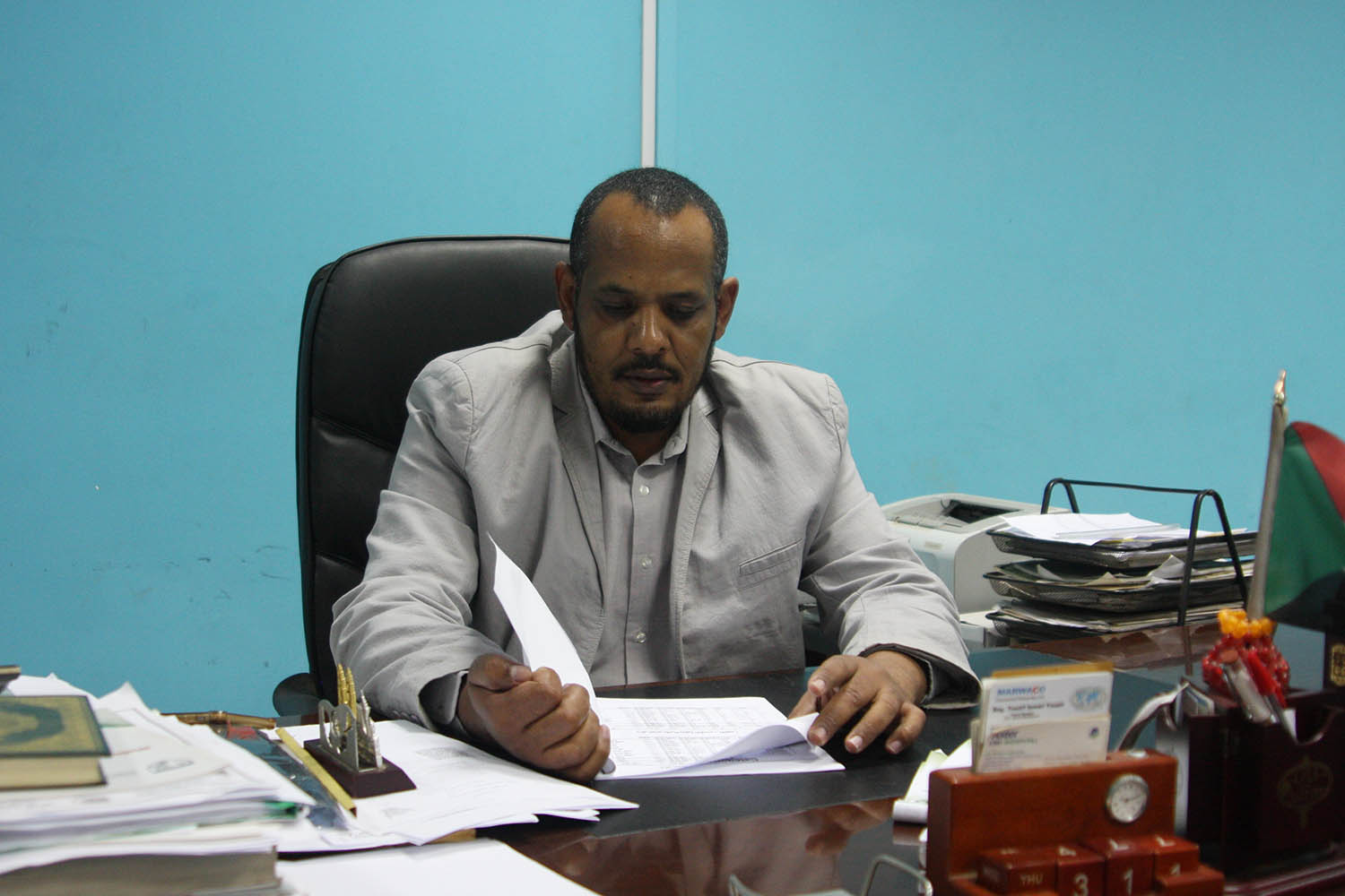 Mohammed Elhag Hamed, a physician at Omdurman Teaching Hospital, looks over some of the files documenting corruption under the former regime in Omdurman, Sudan, on Nov. 3. Image by Rebecca Hamilton/ Foreign Policy. Sudan, 2019. Mohammed Elhag Hamed, a physician at Omdurman Teaching Hospital, looks over some of the files documenting corruption under the former regime in Omdurman, Sudan, on Nov. 3. Image by Rebecca Hamilton/ Foreign Policy. Sudan, 2019.