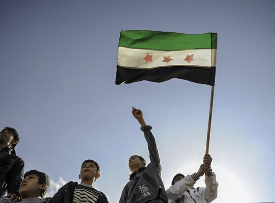 Syrian refugees protest during a demonstration against the Assad regime at Reyhanli Refugee Camp in Antakya. Image by FreedomHouse2, Flickr. Turkey, 2012. Media file: syria.jpg