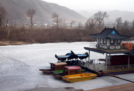 The Tumen River, which separates China (near side) and North Korea (far side). One woman told Newsweek she smuggles ice to a trader in the middle of this river; which demarcates the northern and more accessible border crossing point between the two countries; it’s frozen during the winter and often laxly patrolled. Jilin Province, China. 2011. Media file: tumen-river-drug-smuggling-11_9775_10978_10993.jpg