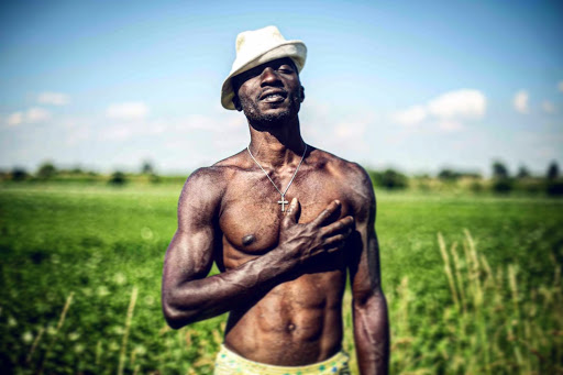 Israel, a 30-year-old Nigerian refugee poses for a portrait in the countryside of Bavaria, Germany. Image by Angèlica Ekeke. Germany, 2019. Israel, a 30-year-old Nigerian refugee poses for a portrait in the countryside of Bavaria, Germany. Image by Angèlica Ekeke. Germany, 2019.